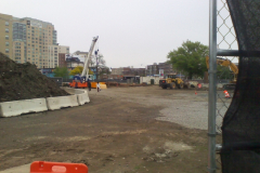 1_three-people-cutting-across-the-site